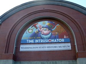 Thanks to the wonderful art of Mike Cressy and the graphic wizard of Gwen Whiting we're gonna have a show! Photo by Gwen Whiting of the exhibit banner at the Washington State History Museum in Tacoma.