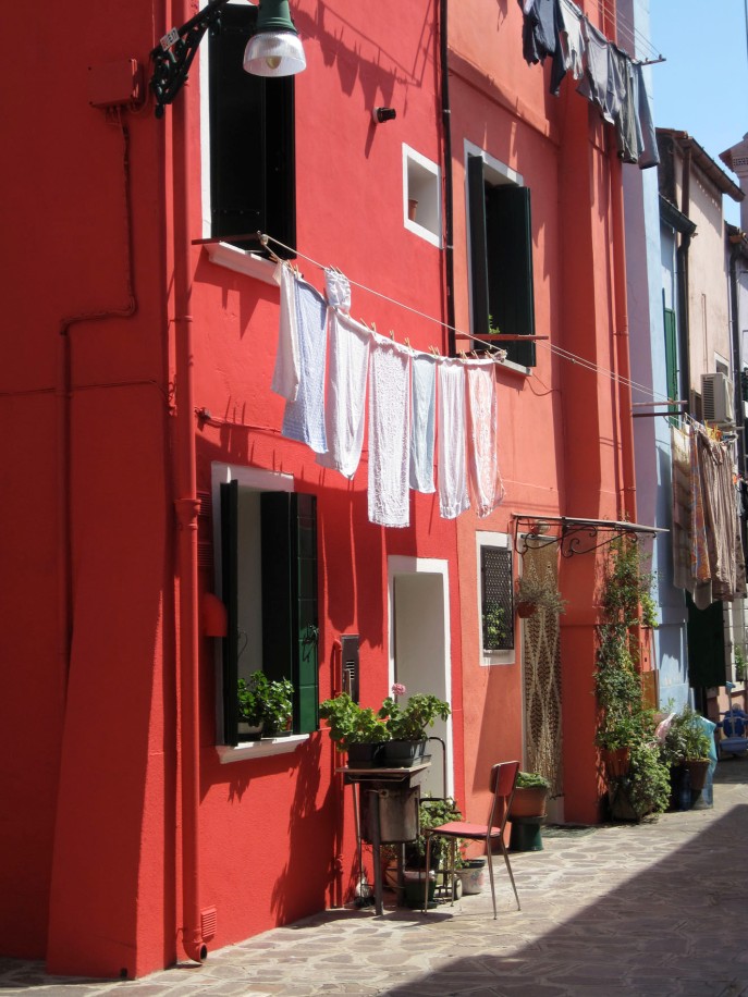 Doing laundry on Burano. Nobody here is afraid of color.